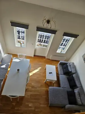 a living room with a couch and a table at Mountain view 2 in Håra