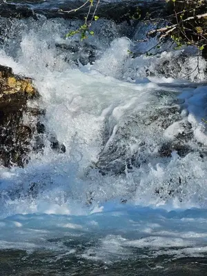 a stream of water with snow on the rocks at Mountain view 2 in Håra