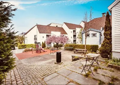 a house with a playground in the yard at Historic Charm in Bergens Heart in Bergen