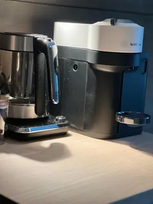 a coffee maker sitting on top of a table at Grandma`s house in Flåm