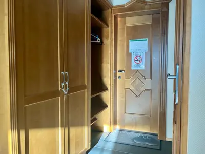 a door to a locker with a sign on it at Leilighet midt i sentrum in Beitostøl