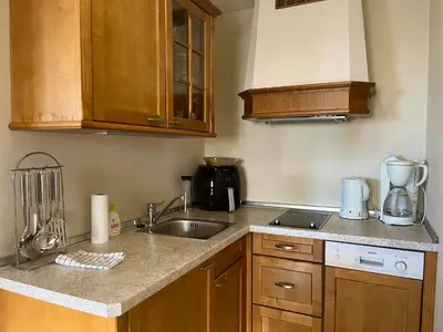 a kitchen with a sink and a counter top at Leilighet midt i sentrum in Beitostøl