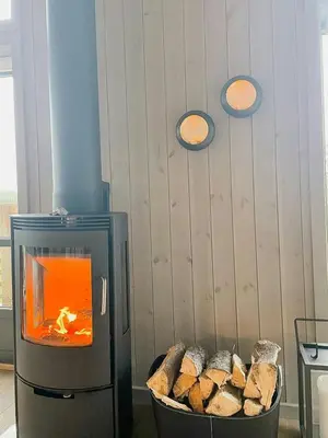 a kitchen with a stove with a bowl of bread at Enjoy The Calm Setting Of This Cozy Family Cabin in Etnedal