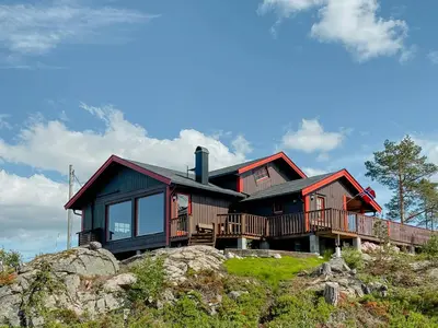 a house on top of a mountain at Fantastic View Cabin In Peaceful Blefjel in Lampeland