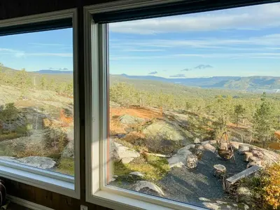a window with a view of a mountain view at Fantastic View Cabin In Peaceful Blefjel in Lampeland