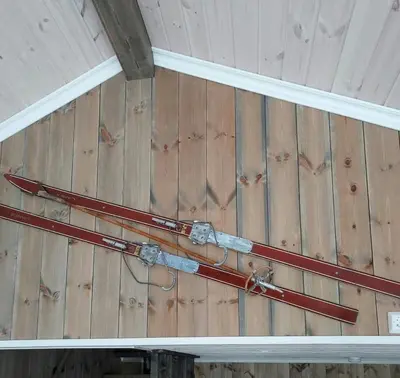 a pair of skis hanging on a wall at Fantastic View Cabin In Peaceful Blefjel in Lampeland