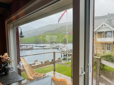 a window with a view of a marina at Unique Modern Harbour Home In Valsøyfjord in Valsøyfjord
