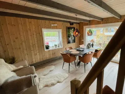 a dining room with a table and chairs at Unique Modern Harbour Home In Valsøyfjord in Valsøyfjord