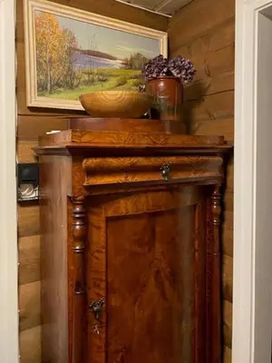 a wooden cabinet with a bowl on top of it at Cabin In Rauland Near Fishing, Hiking And Skiing in Rauland