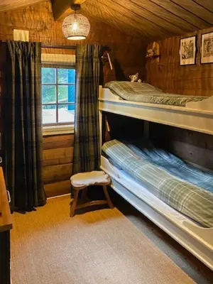 a bedroom with two bunk beds and a window at Cabin In Rauland Near Fishing, Hiking And Skiing in Rauland