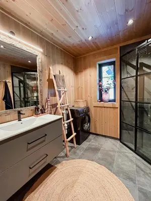 a bathroom with a sink and a ladder in it at Cozy Modern Mountain Cabin At Kvamsfjellet in Kvam