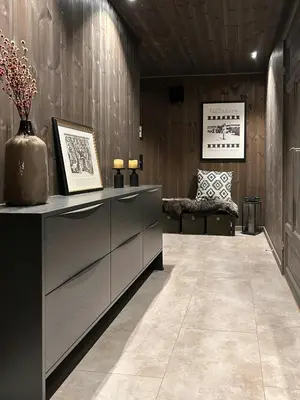 a room with a dresser and a chair in it at Ski-In Ski-Out Apartment In Trysil in Trysil