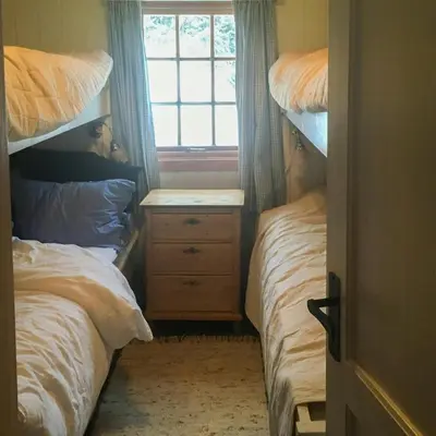 a bedroom with two bunk beds and a window at Mountain Cabin With Views And Close To Ski Trails in Aurdal