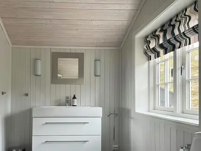 a kitchen with a white cabinet and a window at Designer Cabin With Panoramic Views In Hovden in Bykle