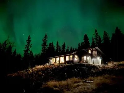 an old cabin under the stars and northern lights at New Cabin With Mountain View In Bittermark, Trysil in Trysil