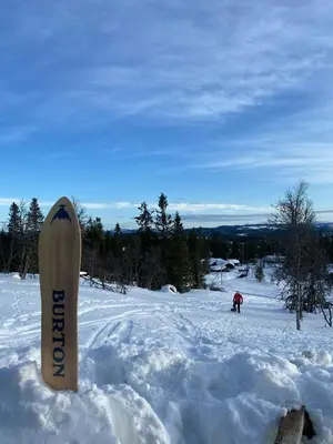 a snowboard is sticking out of the snow at New Cabin With Mountain View In Bittermark, Trysil in Trysil