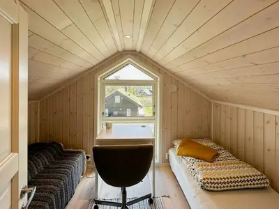 a small room with a bed and a window at Cozy Cabin In Beautiful Area Near Lillehammer in Lillehammer