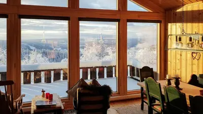 a room with a large window with a view of the city at Charming Cabin With Views In Valdres in Aurdal