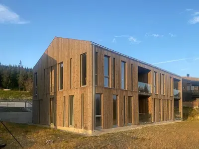 a building under construction in a field at Lovely, New Apartment At Kvitfjell With Ski-In Out in Fåvang
