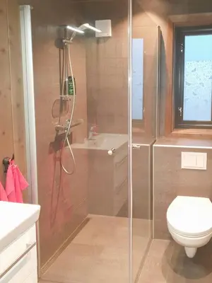 a bathroom with a shower and a toilet at Cozy Ambiance And Trails At Skeikampen in Svingvoll