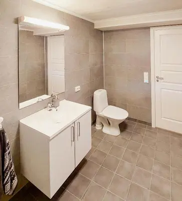 a bathroom with a white sink and a toilet at Unique Cabin By The Ski Slope In Hovden in Hovden