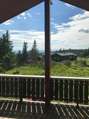 a view from the porch of a house at Charming Cabin With Fantastic View In Sjusjøen in Sjusjøen