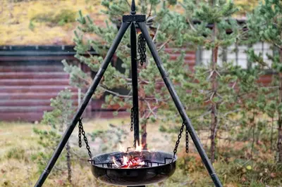 a grill with a fire inside of it at Old Swiss Hotel Charm In Seljestad in Vinjeøra