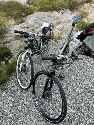 two bikes are parked on a gravel road at Cozy Family Cabin Surrounded By Idyllic Islands in Fitjar