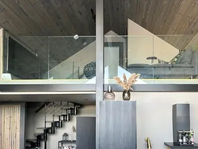 a living room with a staircase in a house at Cabin With Panoramic And Ski Trails Outside in Rauland