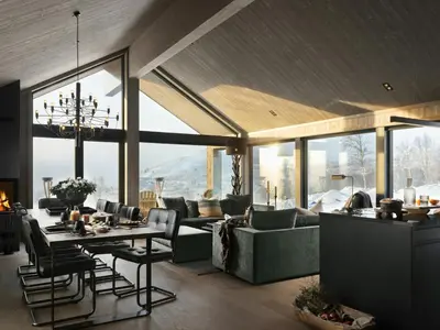 a living room with a couch and a table at Unique & Exclusive Mountain Cabin In Geilo in Geilo