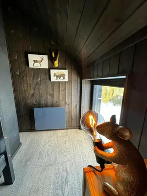 a small room with a bear toy in a room at Modern Apartment Overlooking Gudbrandsdalen in Øyer