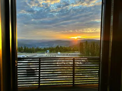 a view of a sunset from a train window at Modern Apartment Overlooking Gudbrandsdalen in Øyer