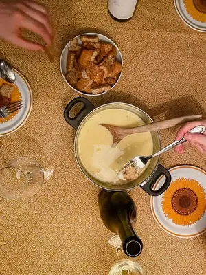a table with a bowl of food and plates of food at Modern Family Cabin At Sjusjøen in Sjusjøen