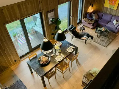 an overhead view of a living room with a table and a dog at Cosy Apartment With Ski Inout In Hafjell in Øyer