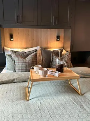 a coffee table sitting on top of a bed at Modern Family Cabin In Norefjell Ski-Inout in Surteberg