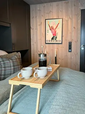 a coffee table with two cups and a tea pot on it at Modern Family Cabin In Norefjell Ski-Inout in Surteberg