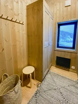 a room with a window and a table and a stool at Stay At Norefjell, Ski-Inout And Panorama in Noresund