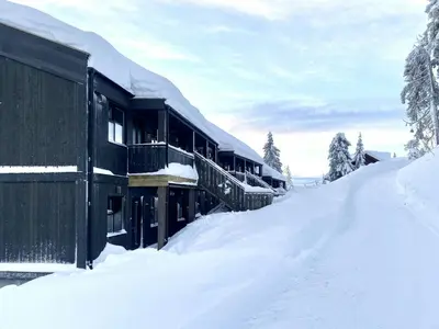 a snow covered building with snow on the ground at Stay At Norefjell, Ski-Inout And Panorama in Noresund