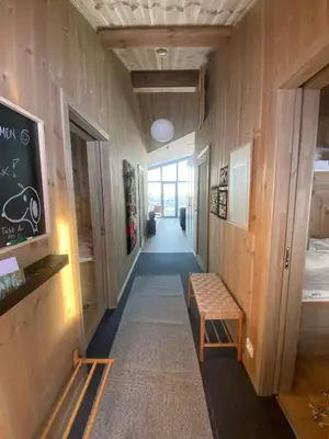 a hallway with a bench and a chalkboard on the wall at Stay At Norefjell, Ski-Inout And Panorama in Noresund