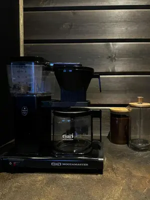 a coffee maker sitting on top of a counter at Idyllic Cabin With Panoramic Mountain Views in Nerskogen