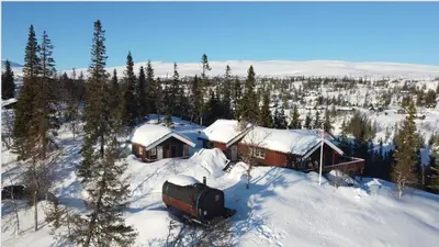 an aerial view of a cabin in the snow at Mountain Cabin With Stunning Views, Sauna & Lake in Eggedal