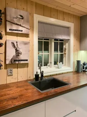 a kitchen with a sink and a window at Mountain Cabin With Sauna, Jacuzzi And Views in Nord Torpa