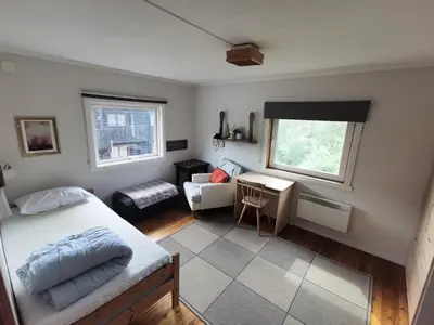 a bedroom with a bed and a desk at Hemsedal - 5 bedrooms in Fausko