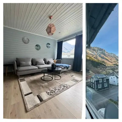 a living room with a couch and a table at StarApartment Trolltunga 2 BR in Odda