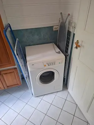 a washer and dryer in a small room at Jordamorstova in Aurland