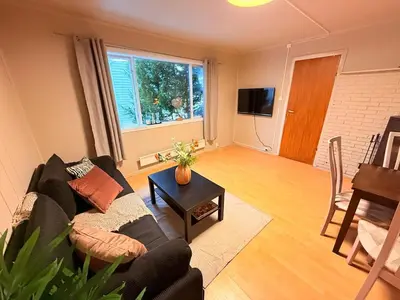 a living room with a couch and a table at Live the history in Bergens heart - Stay unique in Bergen