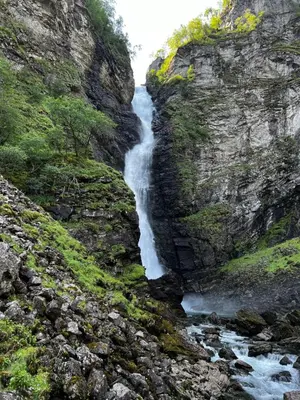 a river flows through a rocky canyon at Voss Apartment in Oppheim Resort, pool and view in Vossevangen