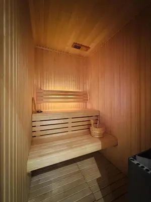 a sauna with a wooden bench in a room at Large, cozy, and spacious cabin in Geilo in Geilo
