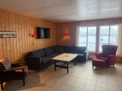 a living room with a couch and a table at Family-Friendly Apartment In Central Beitostølen in Beitostøl