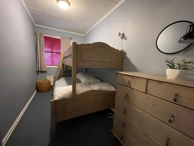 a bedroom with a bunk bed and a dresser at Family-Friendly Stay Near Ski Trails! in Beitostøl